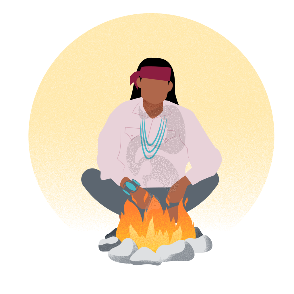 Indigenous elder in front of fire