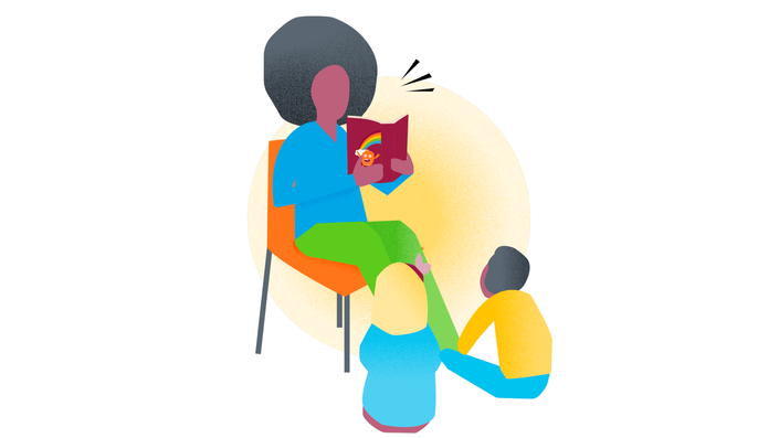 image of educator reading a book to students